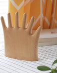 Keep your rings, necklaces, and bracelets organized with a fun twist. This beech wood jewelry display features a regular hand with one extra finger, giving you six spots to hang all your favorite pieces. Perfect for adding a whimsical and functional accent to your dresser or vanity.