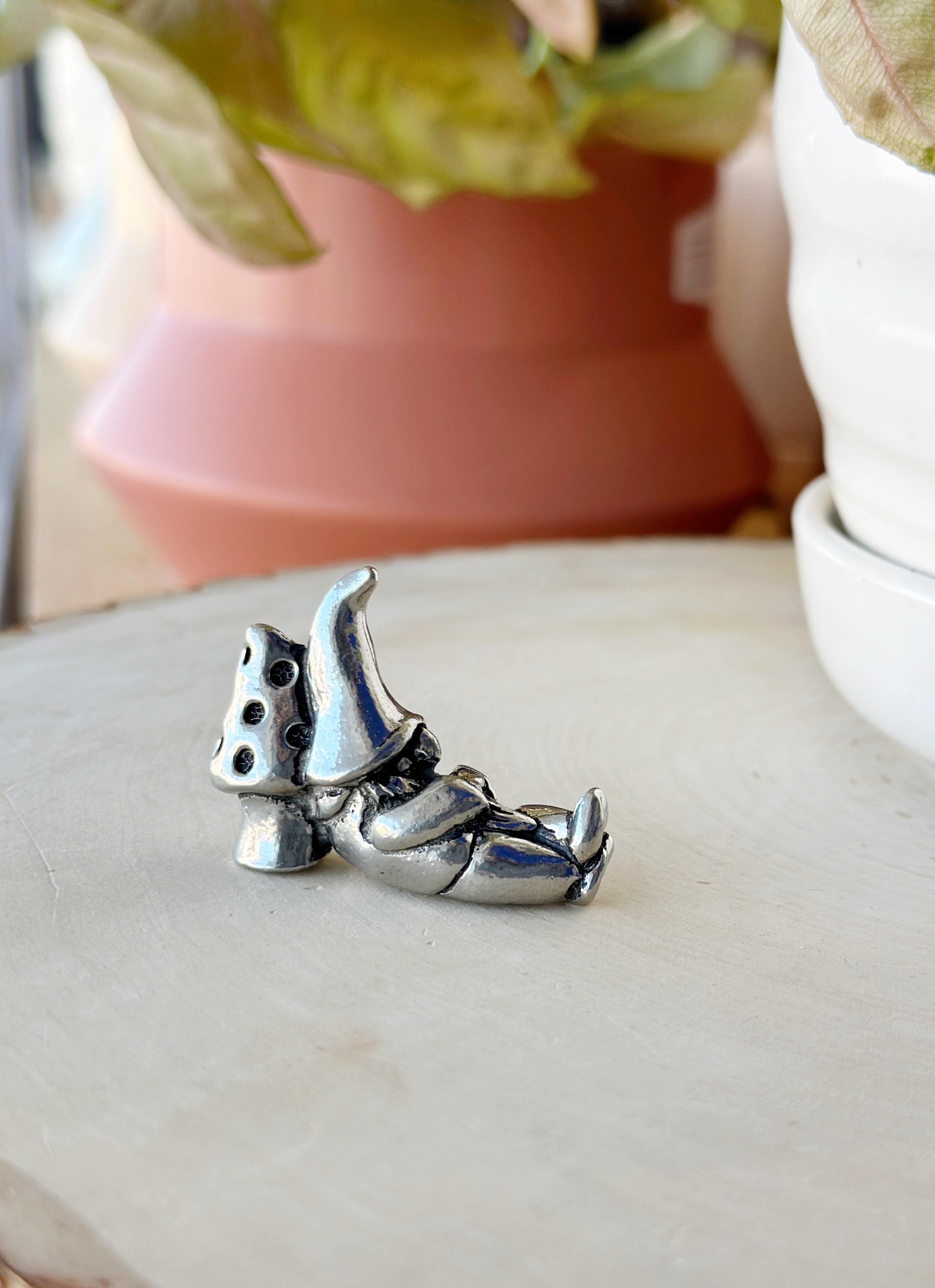 Whimsical 2 in pewter gnome, handcrafted in Canada! With 3 styles—lantern, stick, or mushroom nap—he’s perfect for adding character to your garden or shelf.