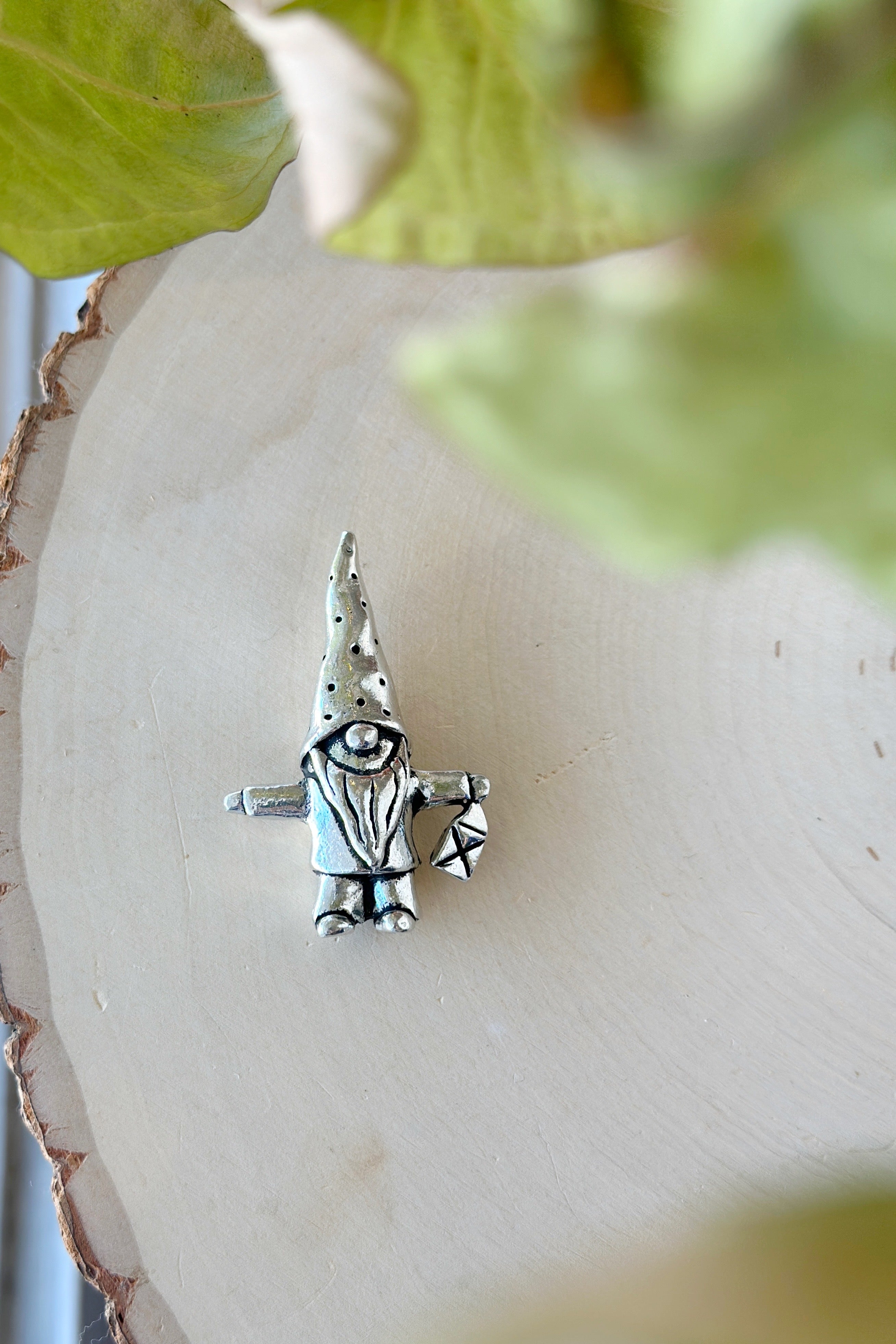 Whimsical 2 in pewter gnome, handcrafted in Canada! With 3 styles—lantern, stick, or mushroom nap—he’s perfect for adding character to your garden or shelf.