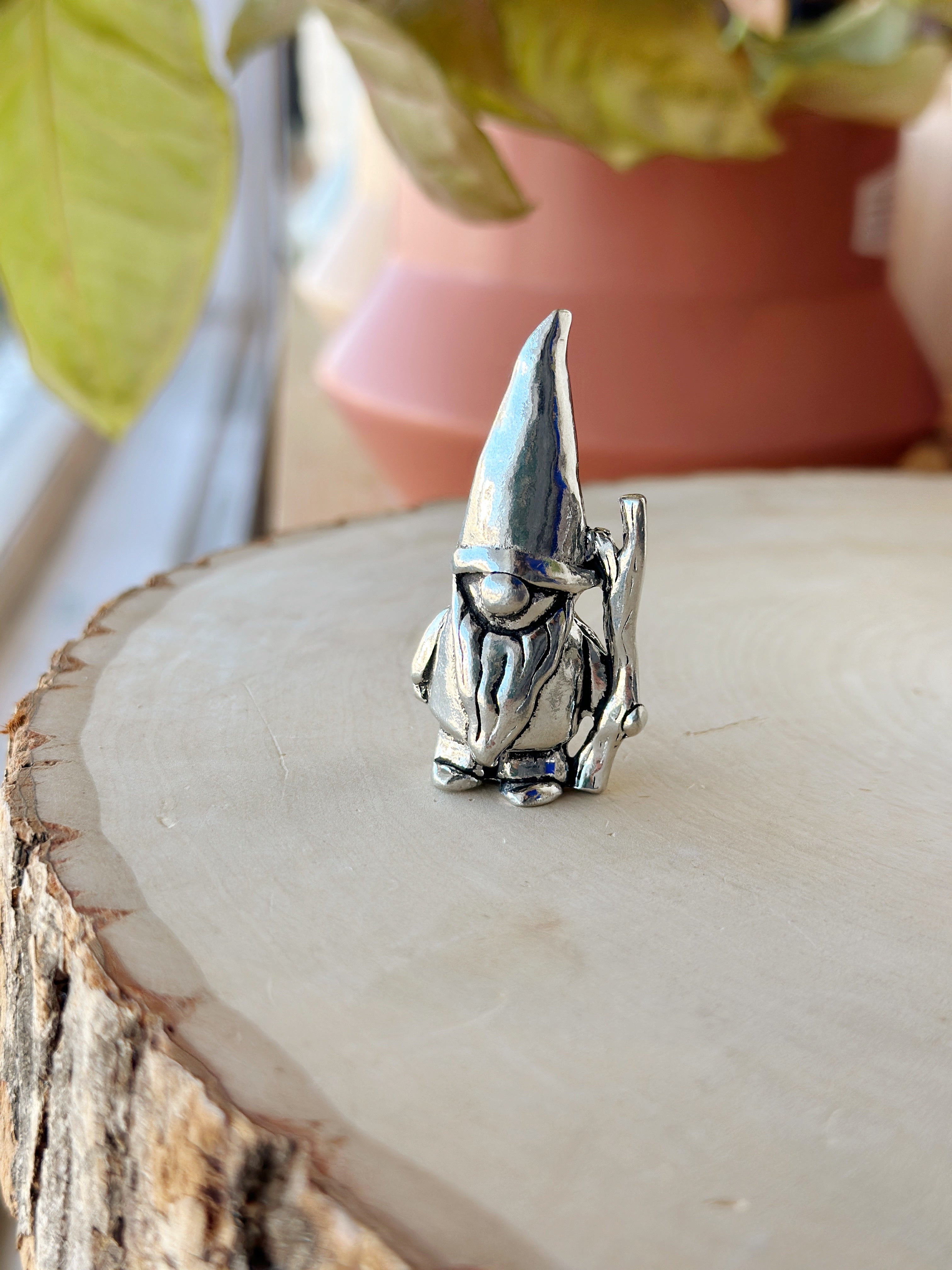 Whimsical 2 in pewter gnome, handcrafted in Canada! With 3 styles—lantern, stick, or mushroom nap—he’s perfect for adding character to your garden or shelf.