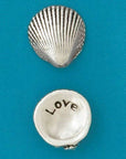 A meaningful keepsake, this pewter shell reveals "love" on the back. Great for collections, gifts, or sharing positivity. Handmade in Canada.