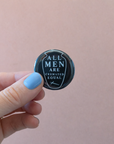 A little dark humor for your jacket, bag, or wherever you pin your personality. 'All Men Are Cremated Equal' — a reminder that in the end, the flames don't play favorites. Pin it loud, pin it proud.