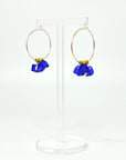 Cool, collected, and effortlessly modern. The Small Anchor Hoops feature a trio of bold cobalt crystal cubes clustered together for a structured, sculptural silhouette. Subtle but striking, they’re your go-to hoops when you want a pop of color with clean, confident lines.