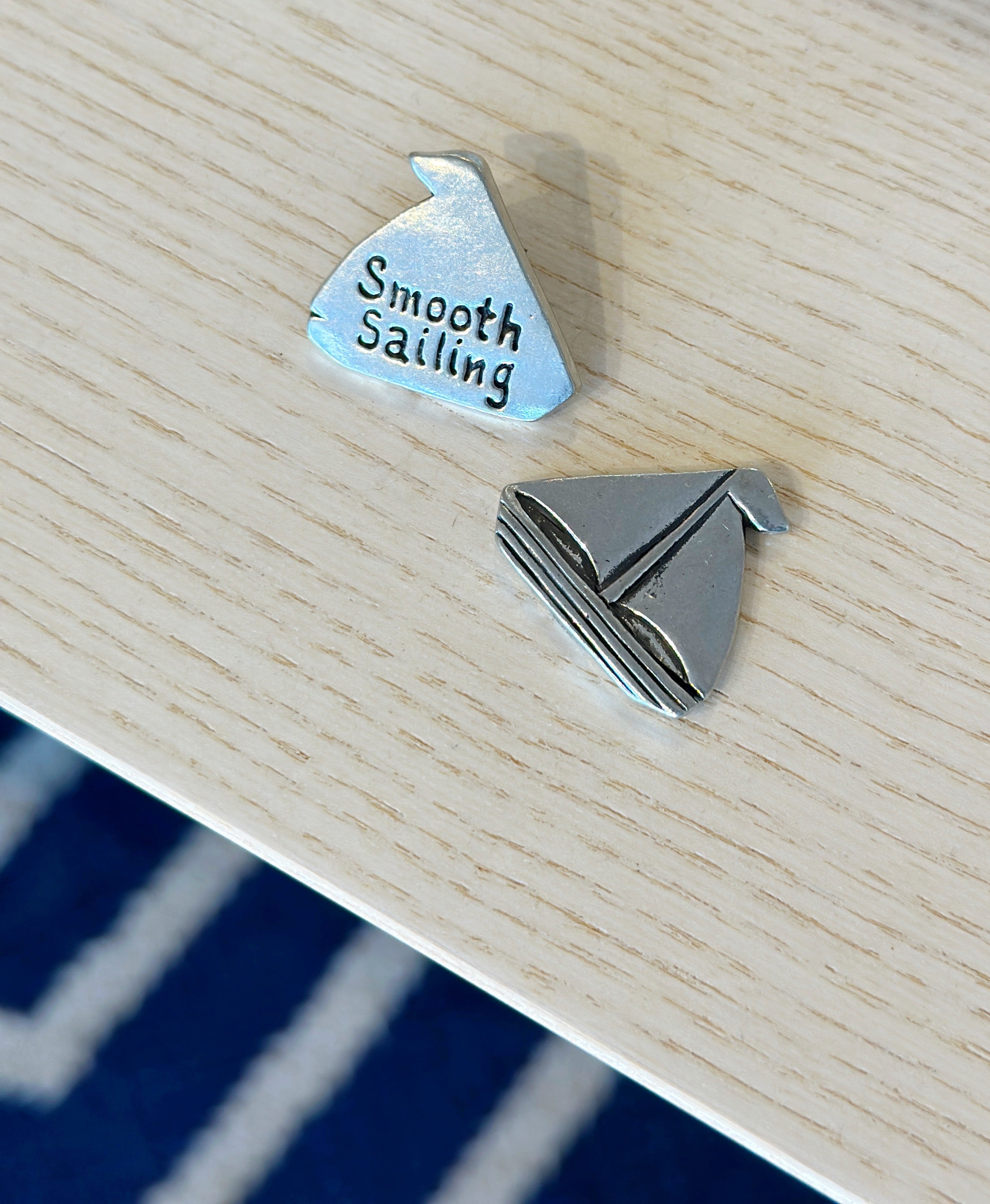 Set sail with the Smooth Sailing Coin! Handcrafted pewter with a sailboat front & “Smooth Sailing” back—perfect for pockets, bags, or a touch of home charm.