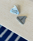 Set sail with the Smooth Sailing Coin! Handcrafted pewter with a sailboat front & “Smooth Sailing” back—perfect for pockets, bags, or a touch of home charm.
