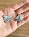 Set sail with the Smooth Sailing Coin! Handcrafted pewter with a sailboat front & “Smooth Sailing” back—perfect for pockets, bags, or a touch of home charm.
