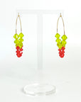 Joyful, flirty, and full of energy—these Small Spark Hoops are a burst of personality. A radiant heart-shaped crystal takes center stage, framed by watermelon and chartreuse tones that feel like summer bottled up. A scattering of dangling crystals adds playful movement, making these hoops perfect for anyone who loves to stand out and shine.