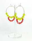 Joyful, flirty, and full of energy—these Small Spark Hoops are a burst of personality. A radiant heart-shaped crystal takes center stage, framed by watermelon and chartreuse tones that feel like summer bottled up. A scattering of dangling crystals adds playful movement, making these hoops perfect for anyone who loves to stand out and shine.