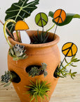 Handcrafted amber stained glass mushroom adds charm to plants or gardens. Weatherproof and pet-safe. Perfect for unique home decor and garden gifts.