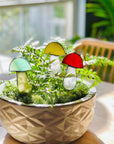 Handcrafted amber stained glass mushroom adds charm to plants or gardens. Weatherproof and pet-safe. Perfect for unique home decor and garden gifts.
