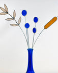 Bring a pop of color and artistry to your home with this handcrafted set of stained glass blue globe thistles by Samara Designs Studio. Each stem is carefully handmade using cobalt blue stained glass, cut and assembled with care to create a lasting botanical accent that will never wilt or fade.