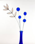 Bring a pop of color and artistry to your home with this handcrafted set of stained glass blue globe thistles by Samara Designs Studio. Each stem is carefully handmade using cobalt blue stained glass, cut and assembled with care to create a lasting botanical accent that will never wilt or fade.
