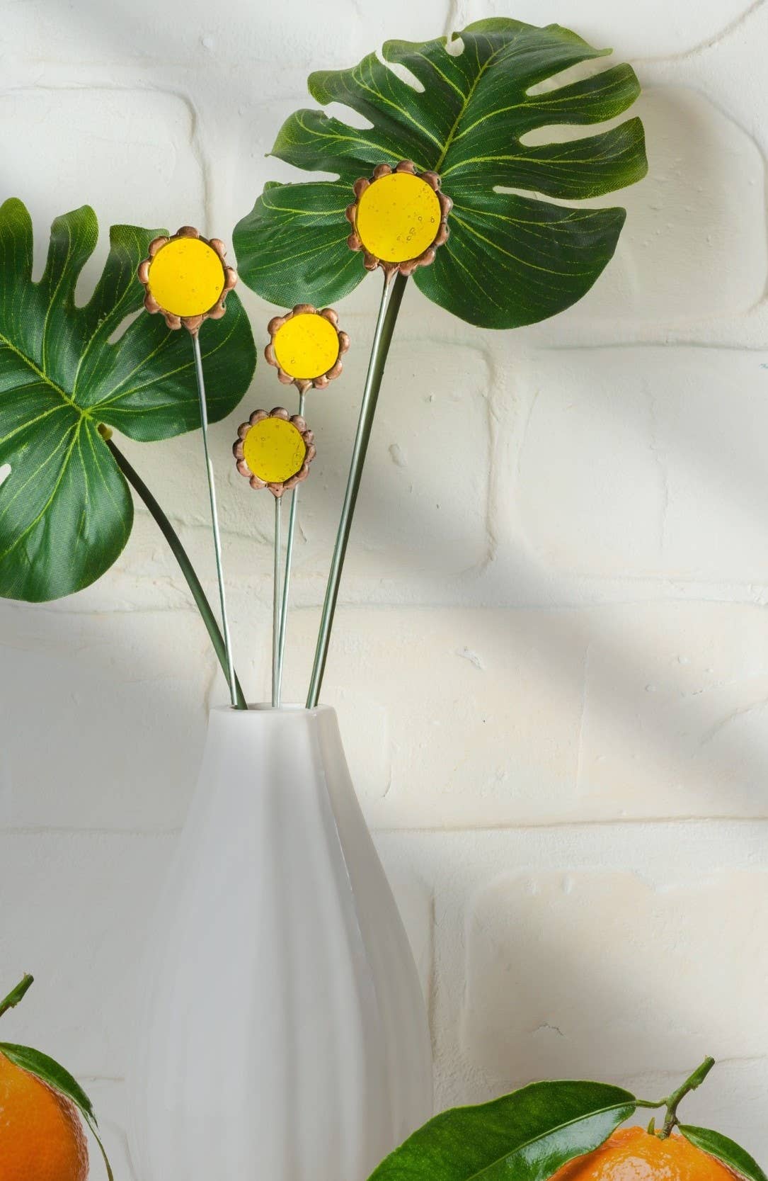 Handmade stained glass buttercups add bright yellow charm to any space. Pet-safe, low-maintenance decor for vases or planters. Set of four stems.