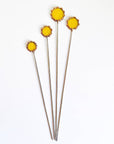 Handmade stained glass buttercups add bright yellow charm to any space. Pet-safe, low-maintenance decor for vases or planters. Set of four stems.