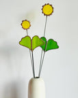 Handmade stained glass buttercups add bright yellow charm to any space. Pet-safe, low-maintenance decor for vases or planters. Set of four stems.