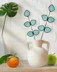 Bring a pop of color and artistry to your home with this handcrafted stained glass gumdrop eucalyptus stem by Samara Designs Studio. This stem is made from beautiful transparent seafoam green stained glass, cut and assembled by hand to create a lasting botanical accent that will never wilt or fade.