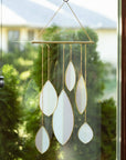 Brighten any room with this pink & green stained glass suncatcher with copper accents—elegant, modern, and perfect as a gift.