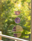 Catch sunlight in a brilliant prismatic display with this rainbow suncatcher—stained glass, gold accents, and vibrant, ever-changing colors.