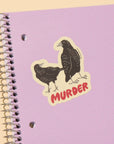 If you didn't know that a group of crows is referred to as a 'murder', now you do! A little spooky and a little smart, this vinyl sticker features two illustrated crows and the word “Murder". It’s durable, waterproof, and dishwasher safe, perfect for laptops, water bottles, notebooks, or anywhere that needs a touch of dark humor.
