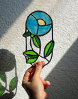 Handcrafted stained glass flower suncatcher. Tulip, blue bud, iris & poppy designs. Floral window decor & nature lover gift for sunny windows.