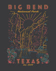 A dark gray graphic print featuring a stylized desert canyon scene with tall rock cliffs, a sun, cacti, and a small boat on water. Text at the top reads “BIG BEND National Park” and text at the bottom reads “TEXAS Est.