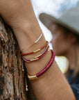 Pick your perfect color.
The Septima Bracelet is made to order in your choice of color from a wide selection of solid hues. It’s an easy way to create something just for you.
Each bracelet is handcrafted with beautiful Japanese glass beads strung on an adjustable 14k gold-filled chain. Choose a color that matches your team, wedding, wardrobe, or mood. The Septima Bracelet is simple, elegant, and uniquely yours.