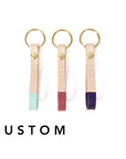 Hand-painted in bold accent colors on genuine leather and is the optimal size for carrying your keys in style. This key fob has a solid rivet and key ring of your choice, and features up to three hand-tooled initials! Hand-painted in bold accent colors on natural veg-tanned leather, this key fob has a solid brass rivet and split ring, and is the optimal size for carrying your keys in style. Available in your choice of any of our custom colors.