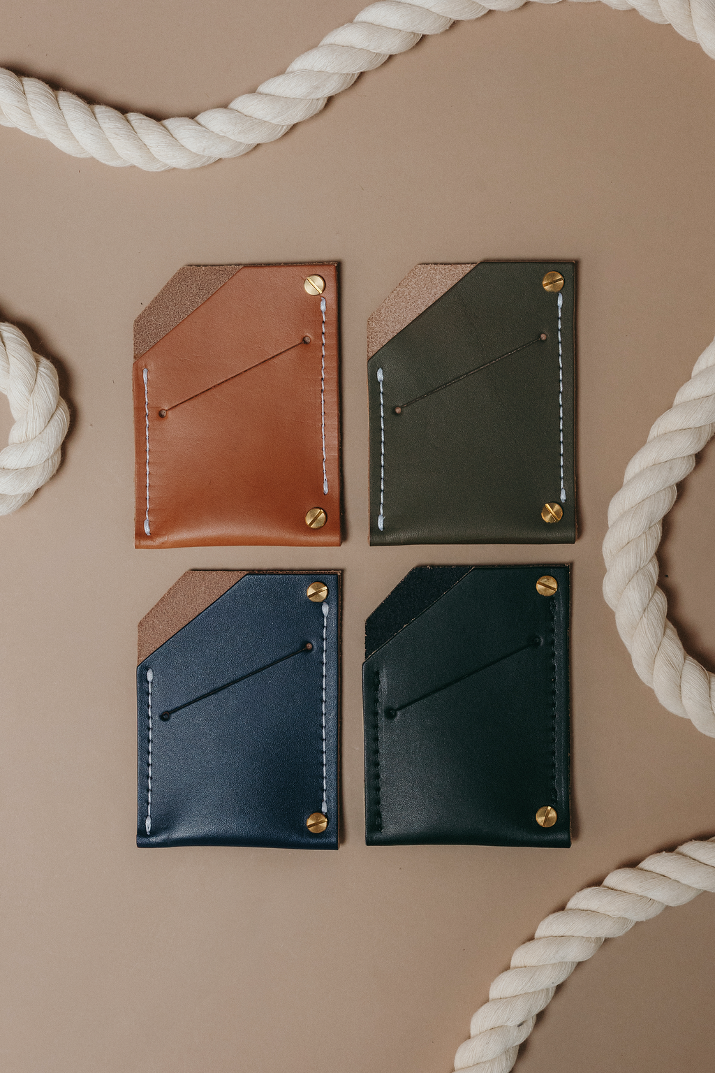 Quebec wallets in tan, olive, indigo and black