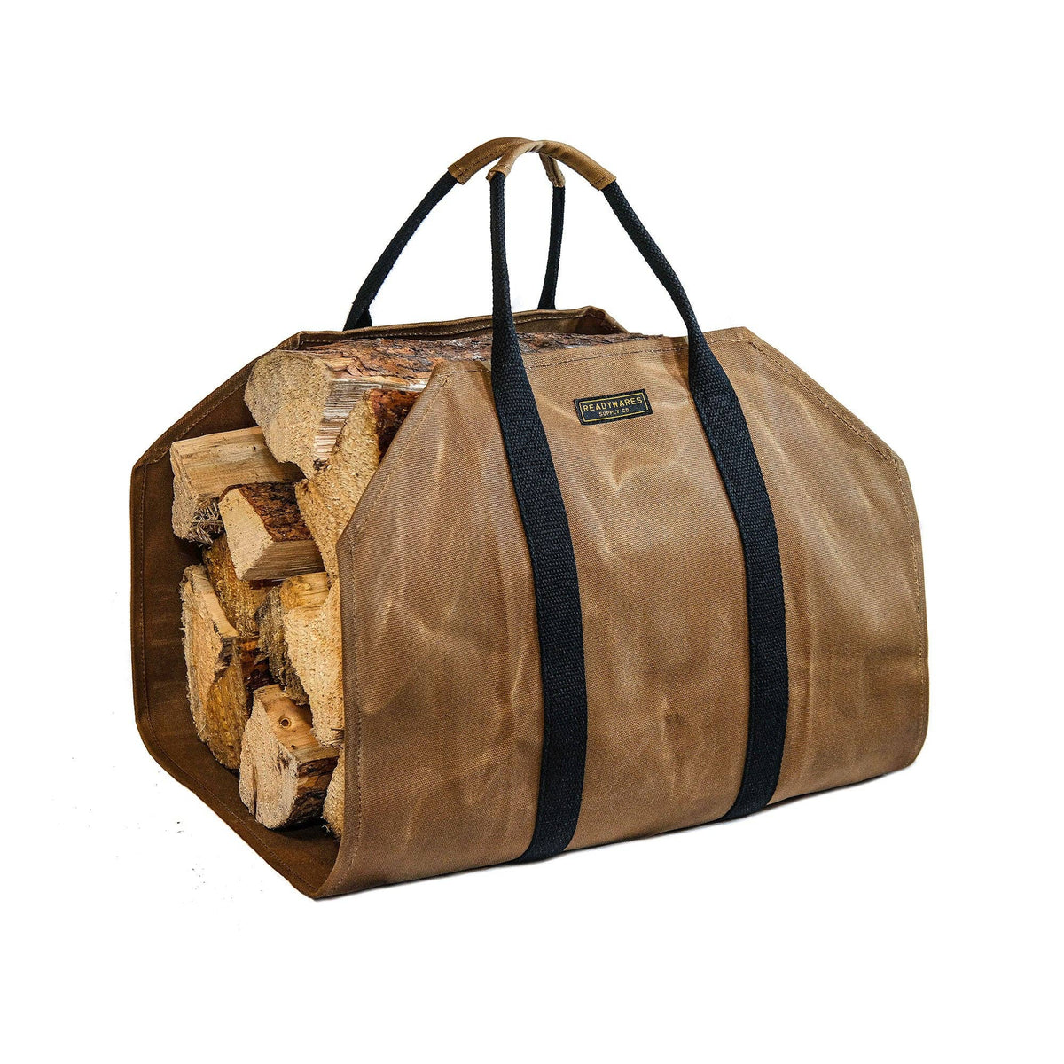 Tan waxed canvas firewood log carrier with webbing handles