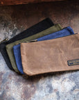 Waxed canvas zip pouches in tan, olive, navy and black