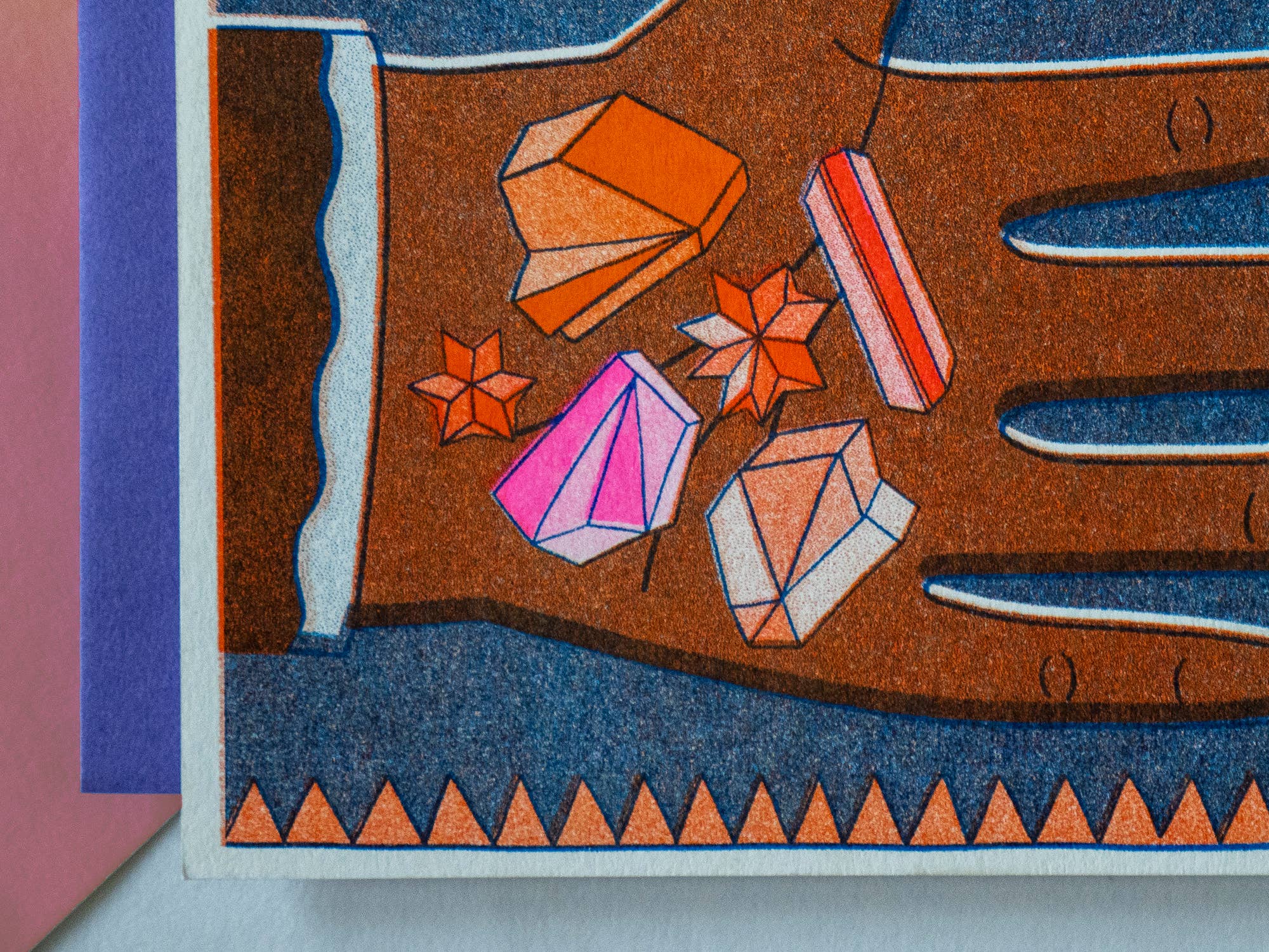 Colorful gemstone illustration on a textured surface with geometric patterns.