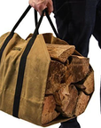 Tan waxed canvas firewood log carrier with webbing handles