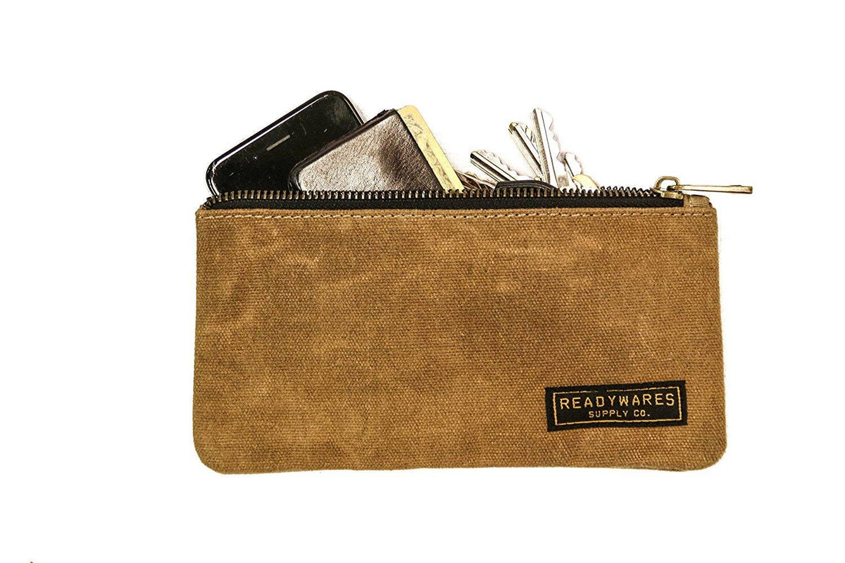 Waxed canvas zip pouches in tan, olive, navy and black