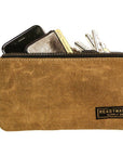 Waxed canvas zip pouches in tan, olive, navy and black