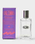 Purple Blomb No. 16 box beside a clear glass Blomb perfume bottle with a silver cap on a gray background
