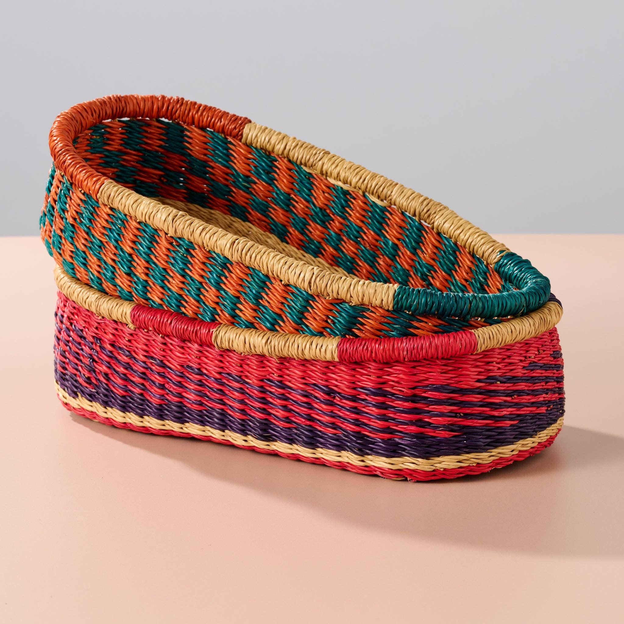 Add these bright, handcrafted baskets to your table, shelf or closet - the uses are limited only by your imagination! Gorgeously handwoven from locally sourced veta vera grass, the utilitarian design features an assortment of vibrant colors. Each one is woven while wet and can be re-shaped by adding water, perfect for the kitchen and bath! Durable and washable, these baskets are a beautiful and unique addition to any decor.&nbsp;