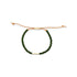 Dark green glass bead bracelet on tan leather cord on a white background