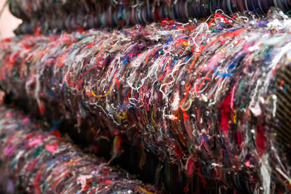 Close-up of shredded multicolored recycled fibers used to weave Compadre blankets
