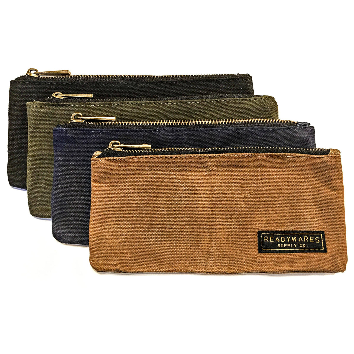 Waxed canvas zip pouches in tan, olive, navy and black