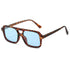 Retro sunglasses with a tortoiseshell double-bridge frame and light blue lenses