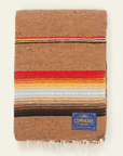 Camel brown sarape blanket with a band of red, light blue and dark brown stripes