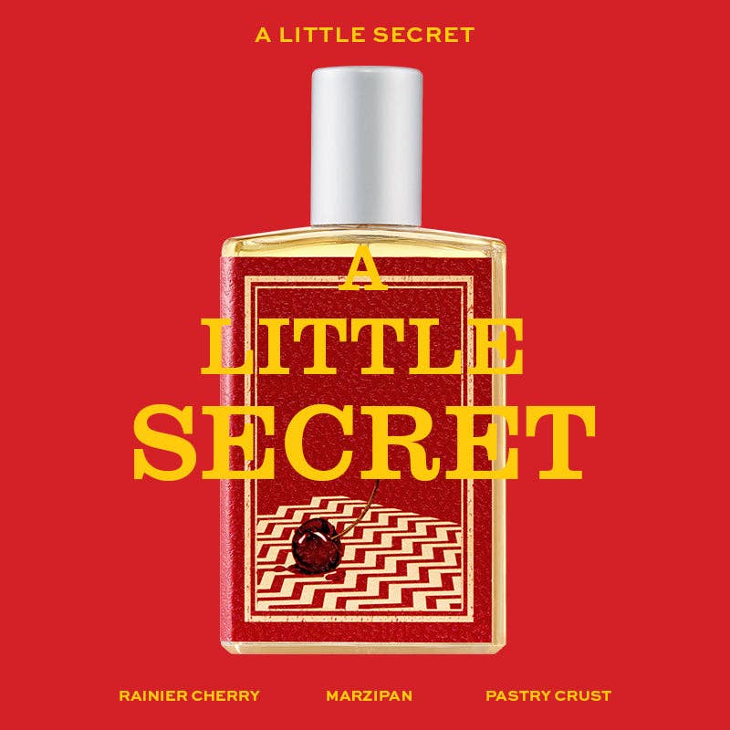 A Little Secret full-size bottle illustration with a red and gold label, listing Rainier cherry, marzipan and pastry crust, on a red background
