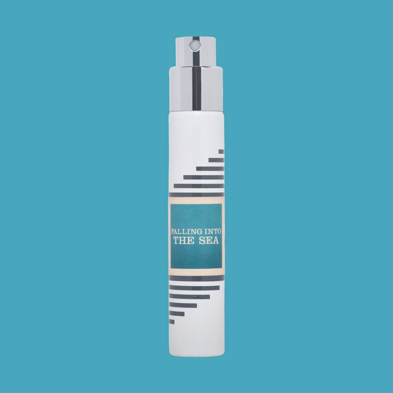 White Imaginary Authors travel spray with a blue Falling into the Sea label on a blue background