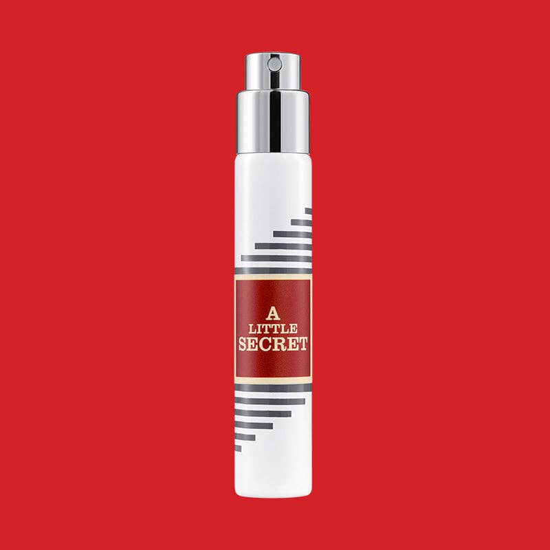 White Imaginary Authors travel spray with a red A Little Secret label on a red background