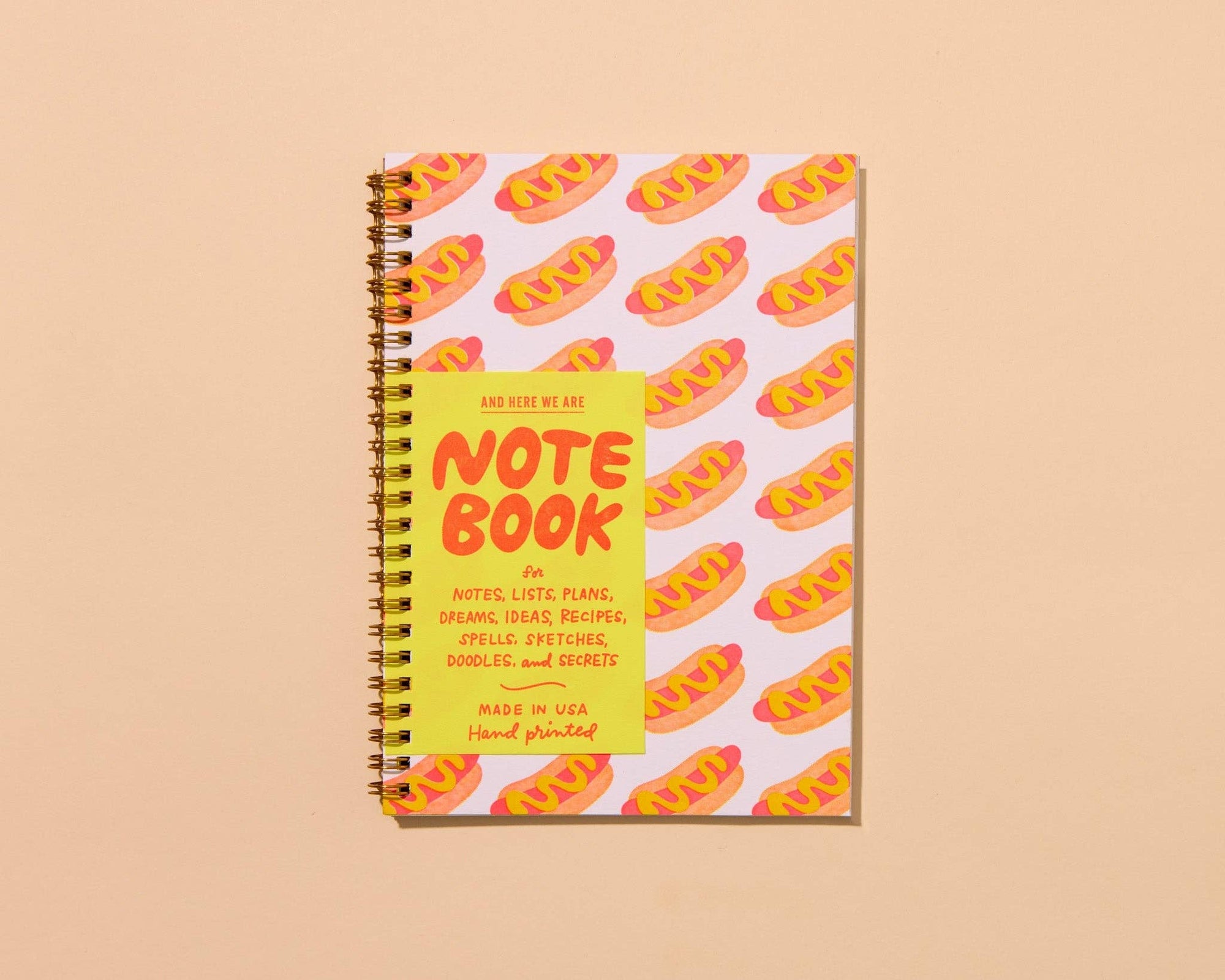 Hot dog A5 spiral notebook with letterpress cover and 48 lined pages. A fun and functional pick for food lovers. Made in the USA with recycled paper.