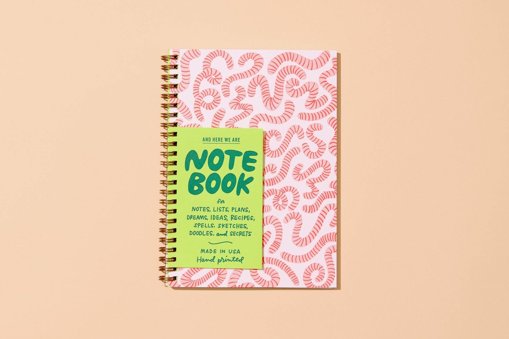 Unlock your inner child with this delightfully wiggly worm notebook. Featuring a quirky worm pattern on a letterpress printed cover, this A5 spiral notebook is just the right size for lists, doodles, and garden daydreams.