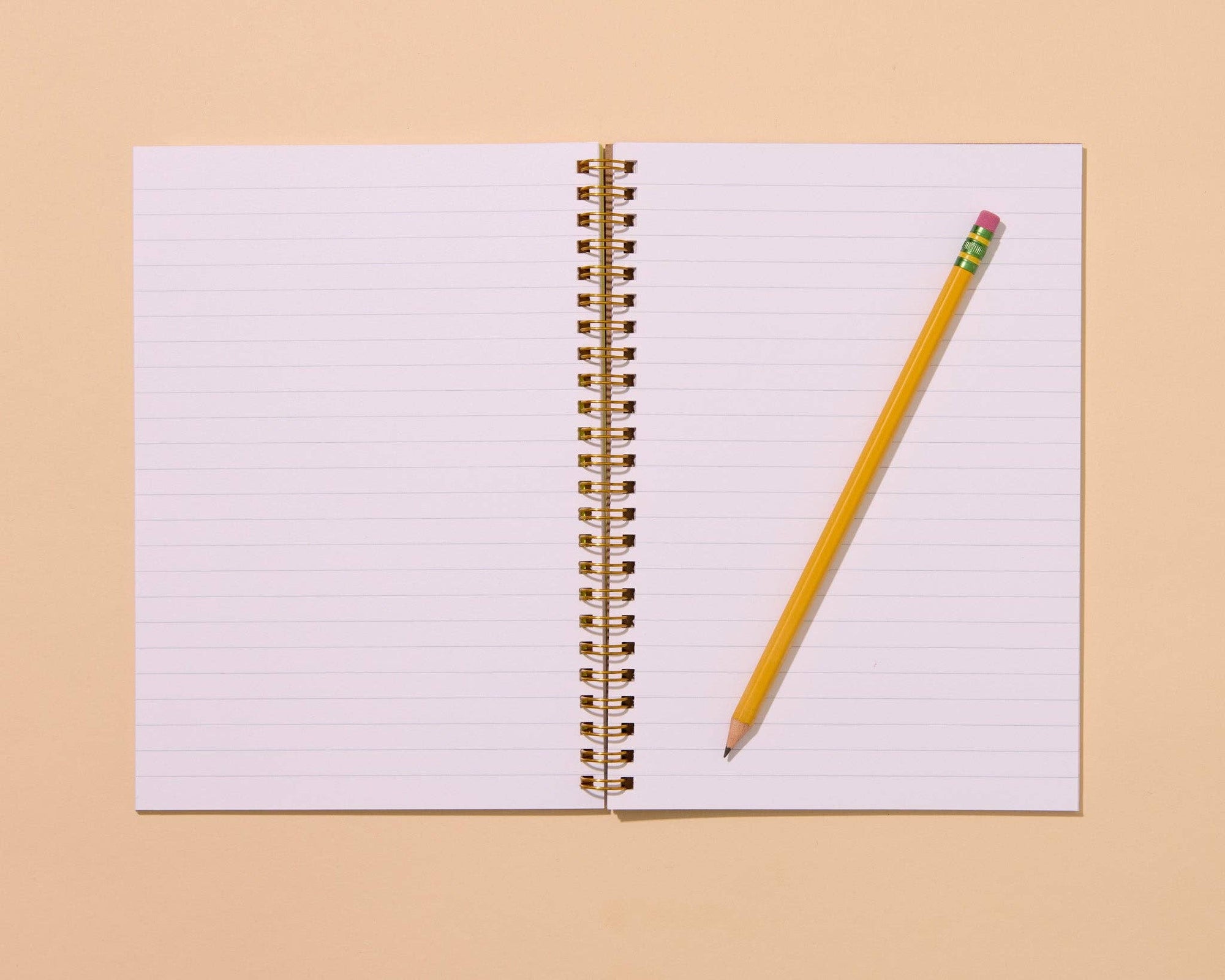 Unlock your inner child with this delightfully wiggly worm notebook. Featuring a quirky worm pattern on a letterpress printed cover, this A5 spiral notebook is just the right size for lists, doodles, and garden daydreams.