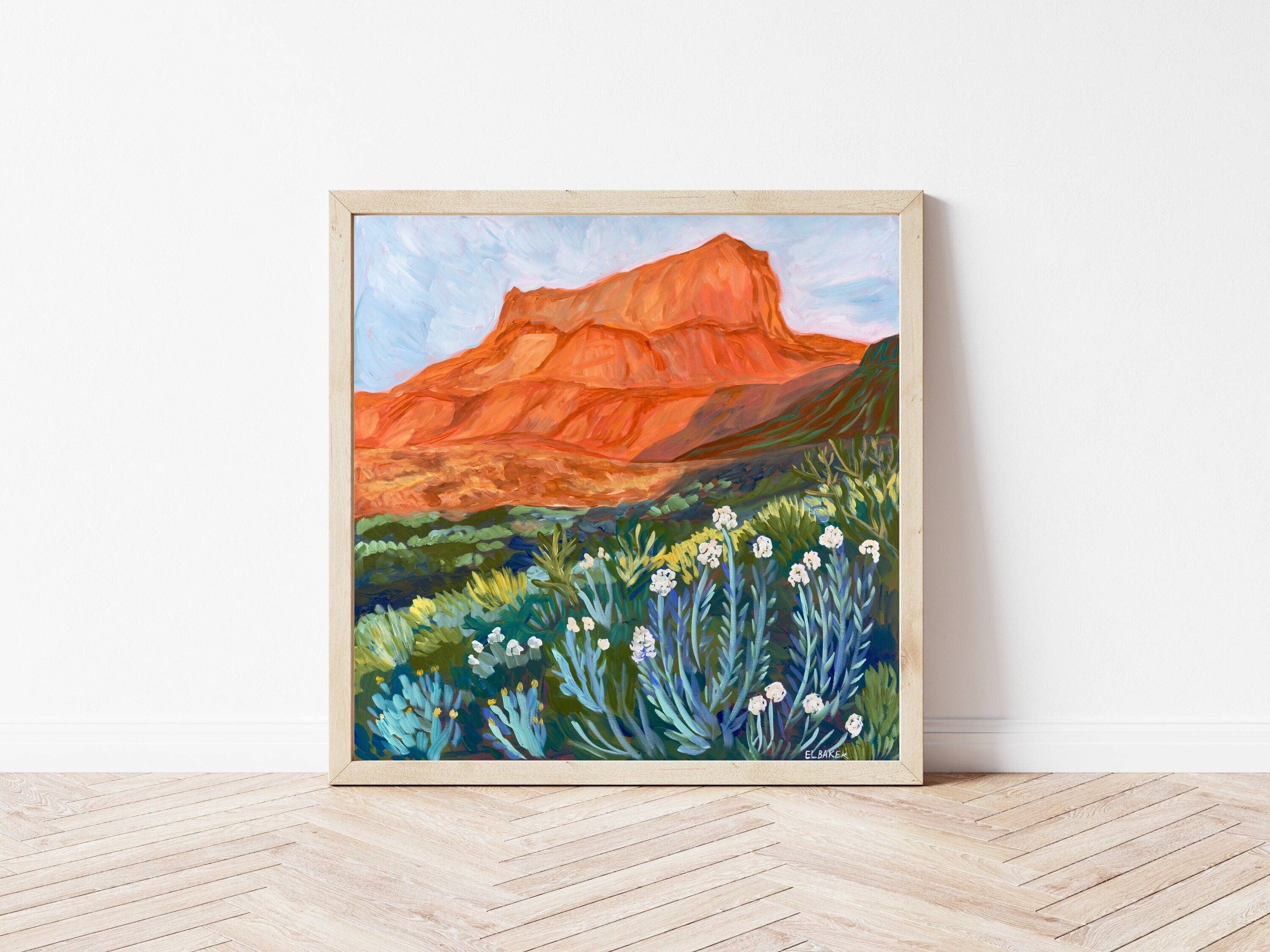 Catch a West Texas sunset without leaving your living room. This vibrant 12 x 12 inch art print by Austin artist&nbsp;El Baker captures the glowing red cliffs and wild desert blooms of Big Bend National Park. The bold brushstrokes and warm hues bring the landscape to life, evoking the magic of golden hour in one of Texas’s most iconic parks.

This high-quality fine art giclée print highlights the rich color and texture of the original painting. Created on thick, durable matte paper, each museum-quality art 