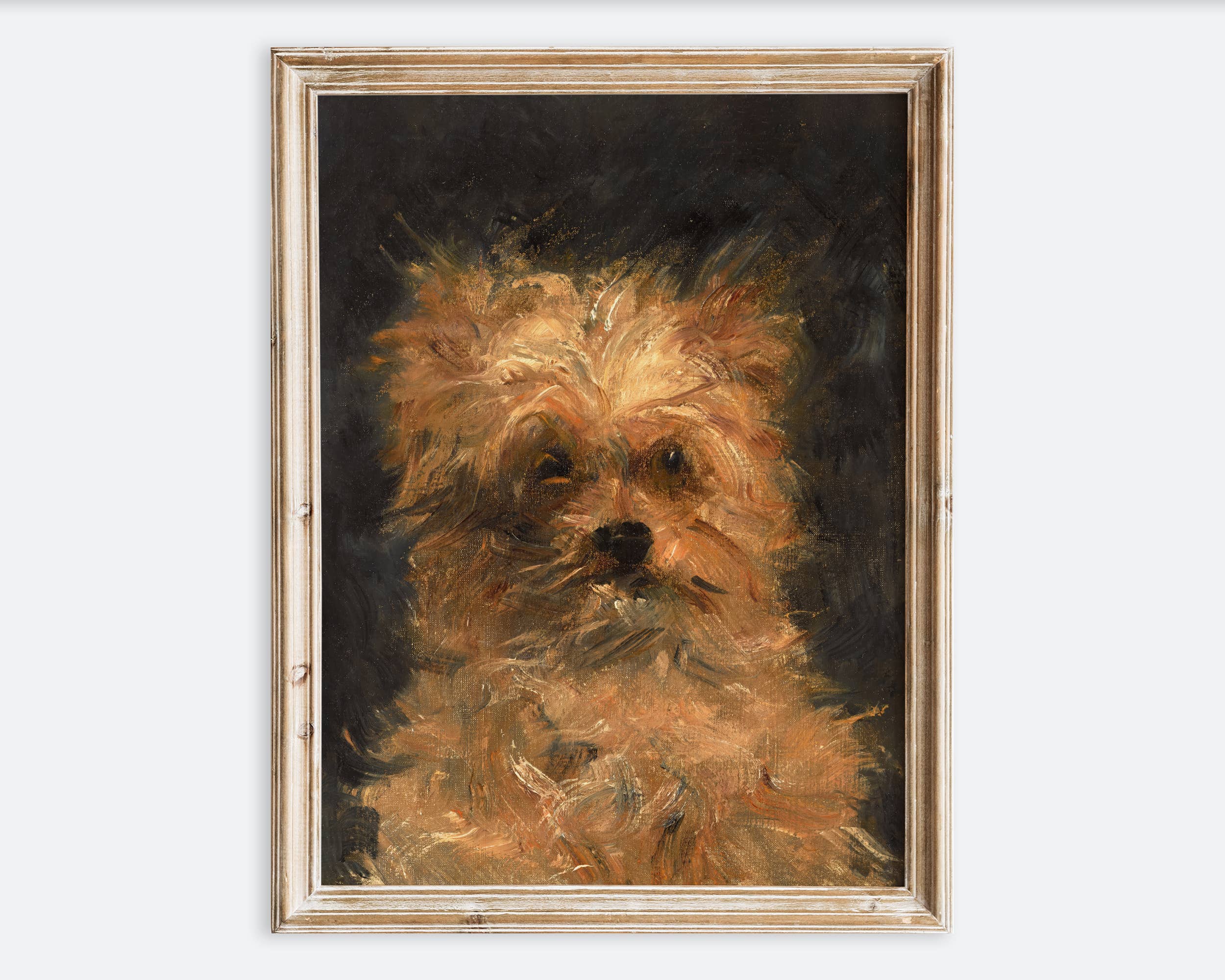 Framed painting of a dog's face on a white wall