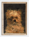 Framed painting of a dog's face on a white wall